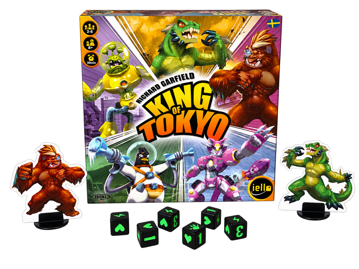 King of Tokyo svensk utgåva: asken med två monsterfigurer och sex tärningar, frilagda utan bakgrund.